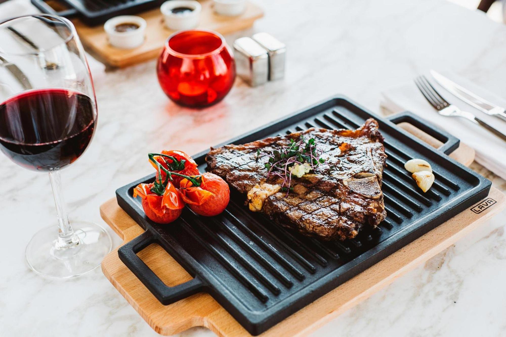 Sheraton Batumi Hotel Εξωτερικό φωτογραφία A steak served on a griddle